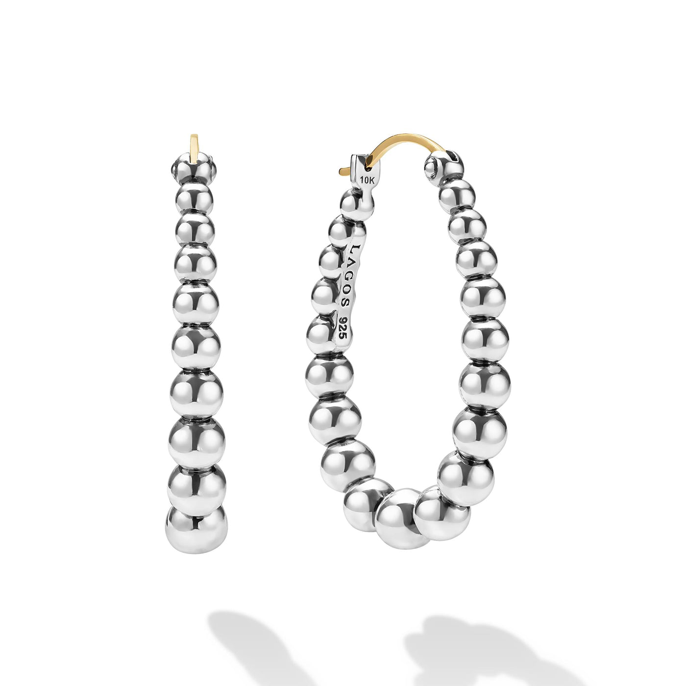 front of oval-shaped sterling silver beaded hoop earrings with LAGOS engraving