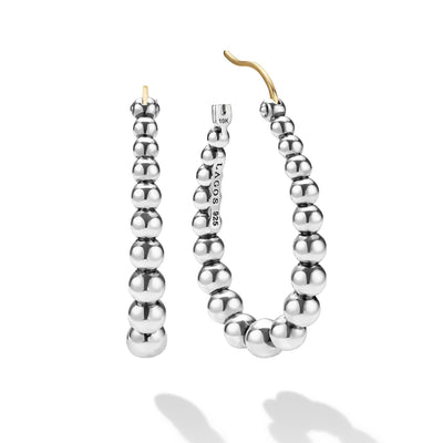 opened oval-shaped sterling silver beaded hoop earrings with LAGOS engraving