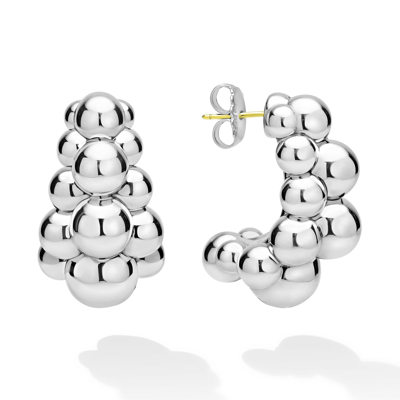 side of three-row beaded sterling silver statement hoop earrings