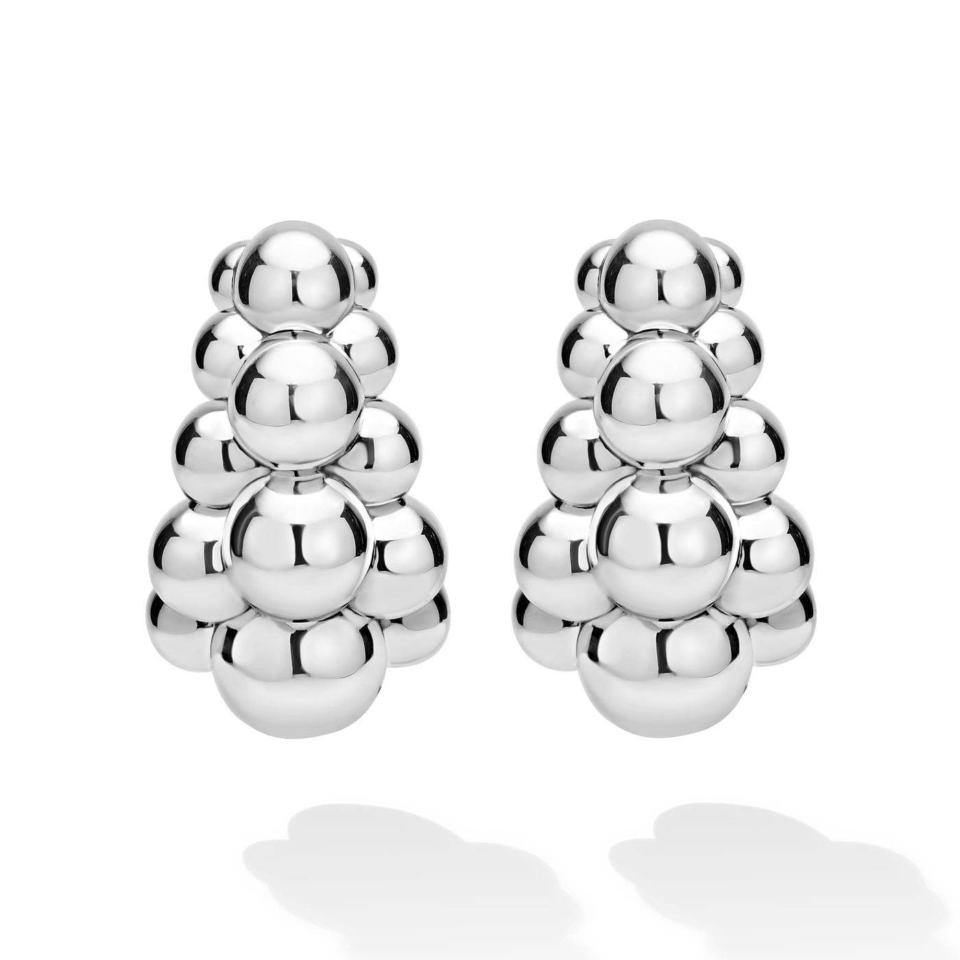 front of three-row beaded sterling silver statement hoop earrings