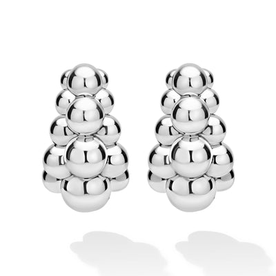 front of three-row beaded sterling silver statement hoop earrings