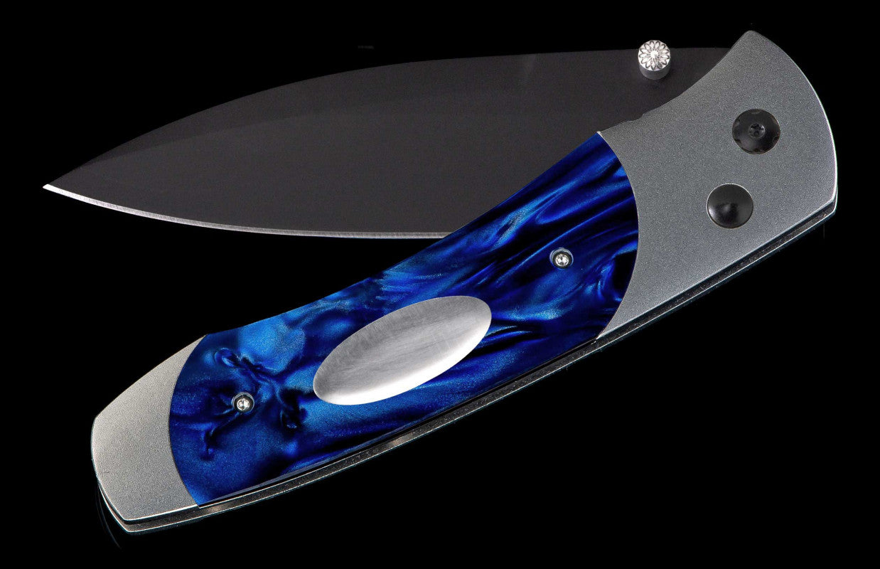 Titanium pocketknife with compressed acrylic resin and stainless blade